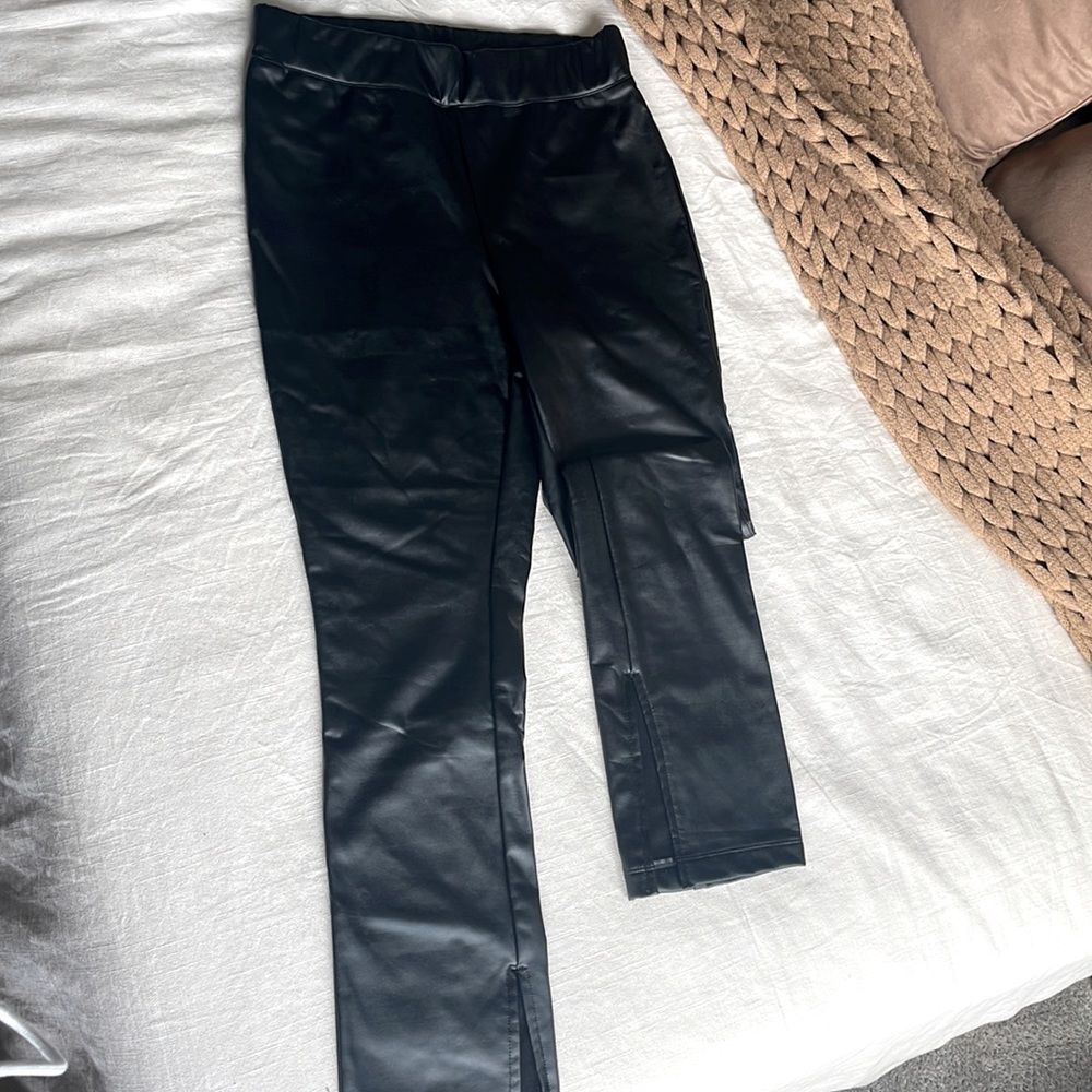 Faux leather leggings. Split hem.
